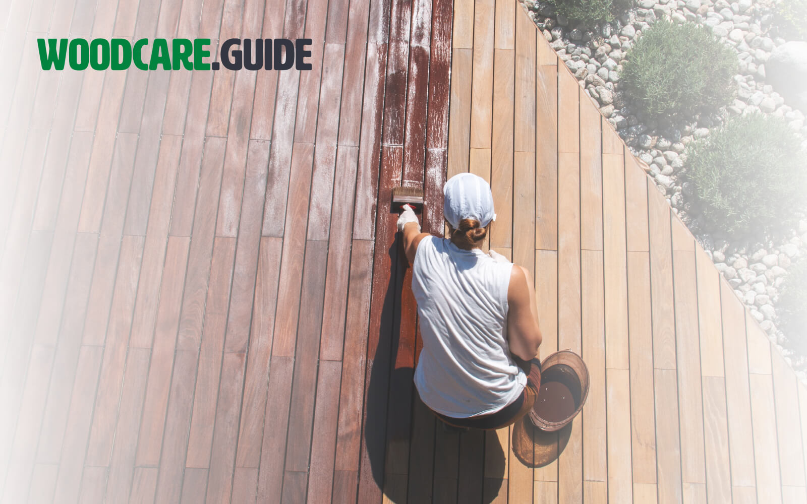 Woman painting a wooden terrace